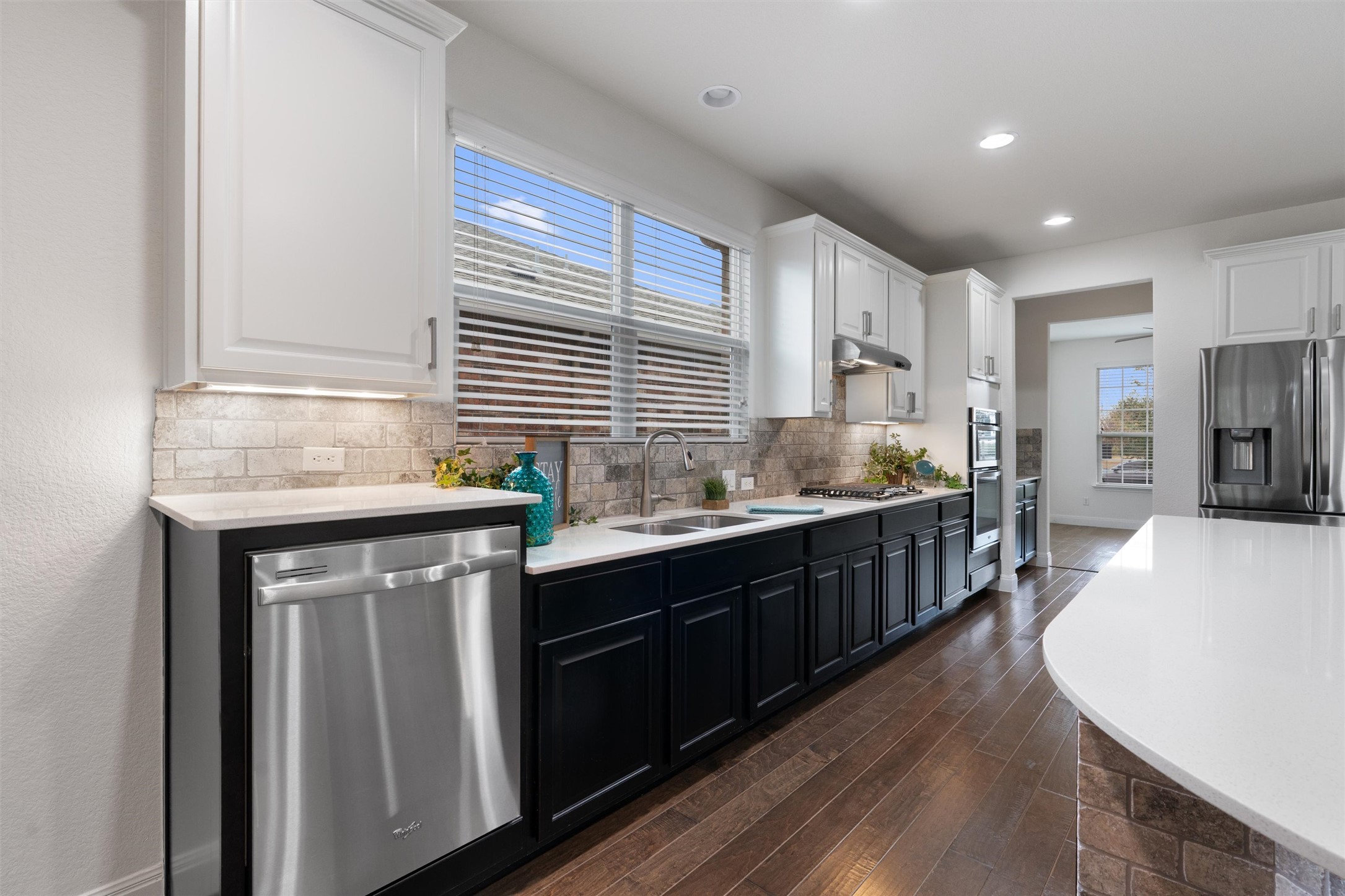706 Kite Ridge Street Georgetown, TX 78633 - Photo 8 of 37 a kitchen with stainless steel appliances granite countertop a sink dishwasher stove and oven