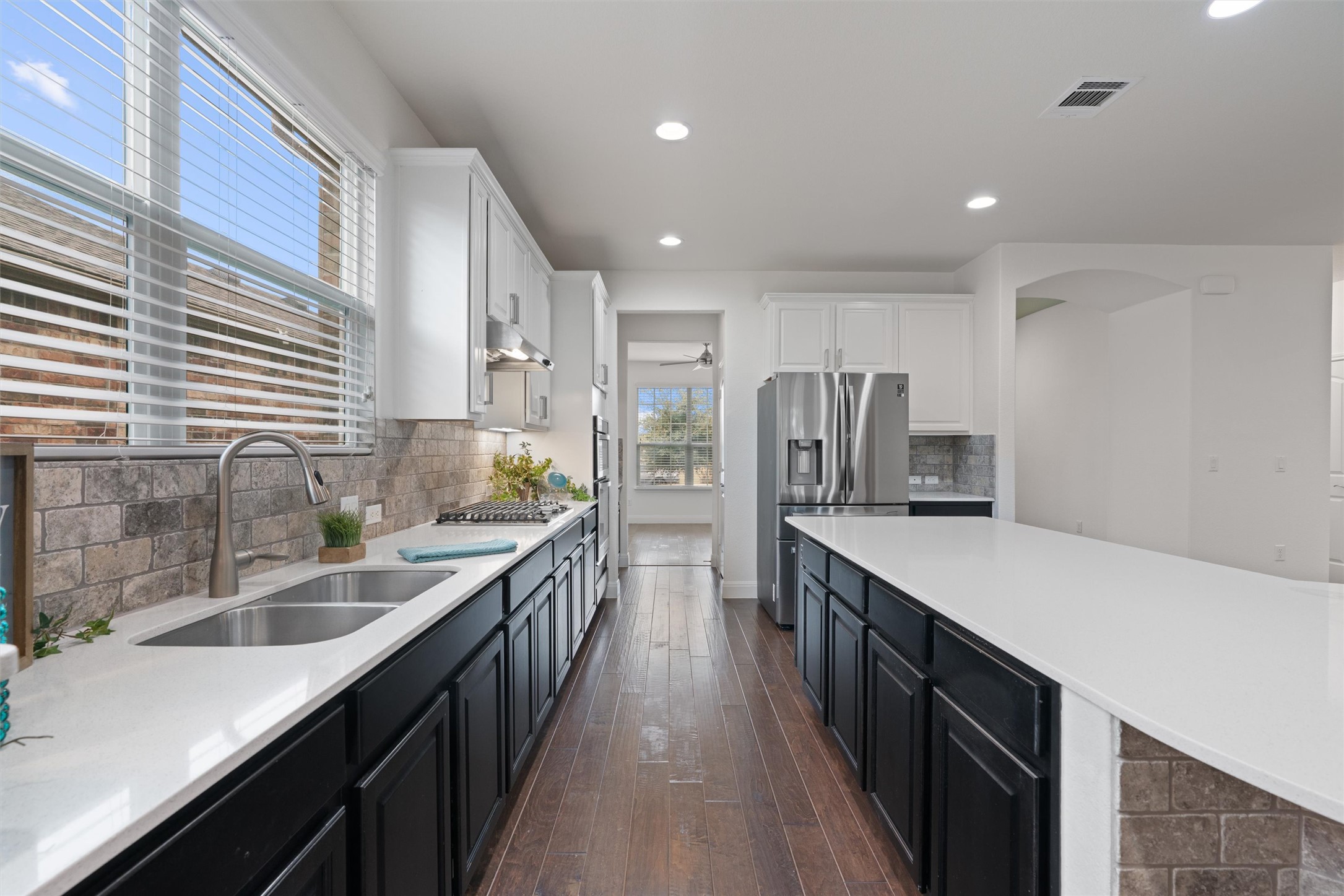 706 Kite Ridge Street Georgetown, TX 78633 - Photo 9 of 37 a kitchen with stainless steel appliances granite countertop sink stove and refrigerator
