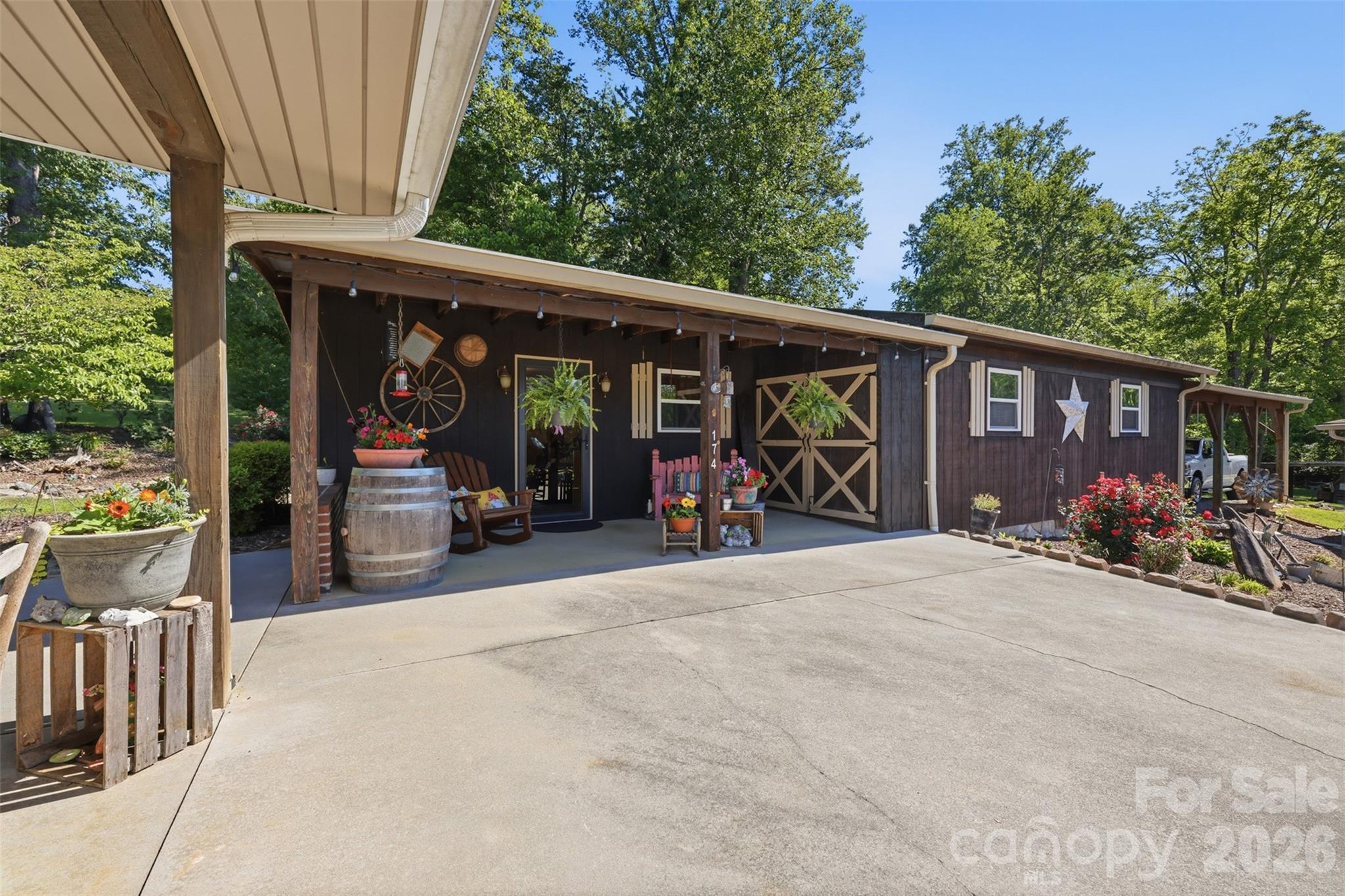 176-174 Oak Hollow Road Union Grove, NC 28689 - Photo 12 of 48 a view of a bike garage with a patio