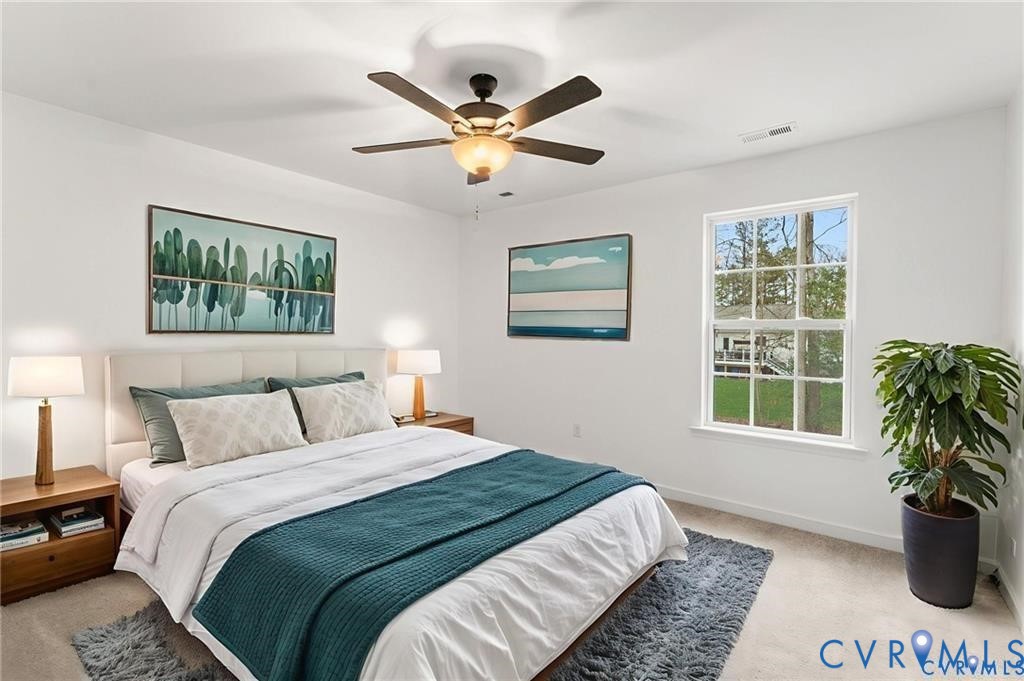 308 Crump Drive Ruther Glen, VA 22546 - Photo 18 of 24 a bedroom with a large bed and a window