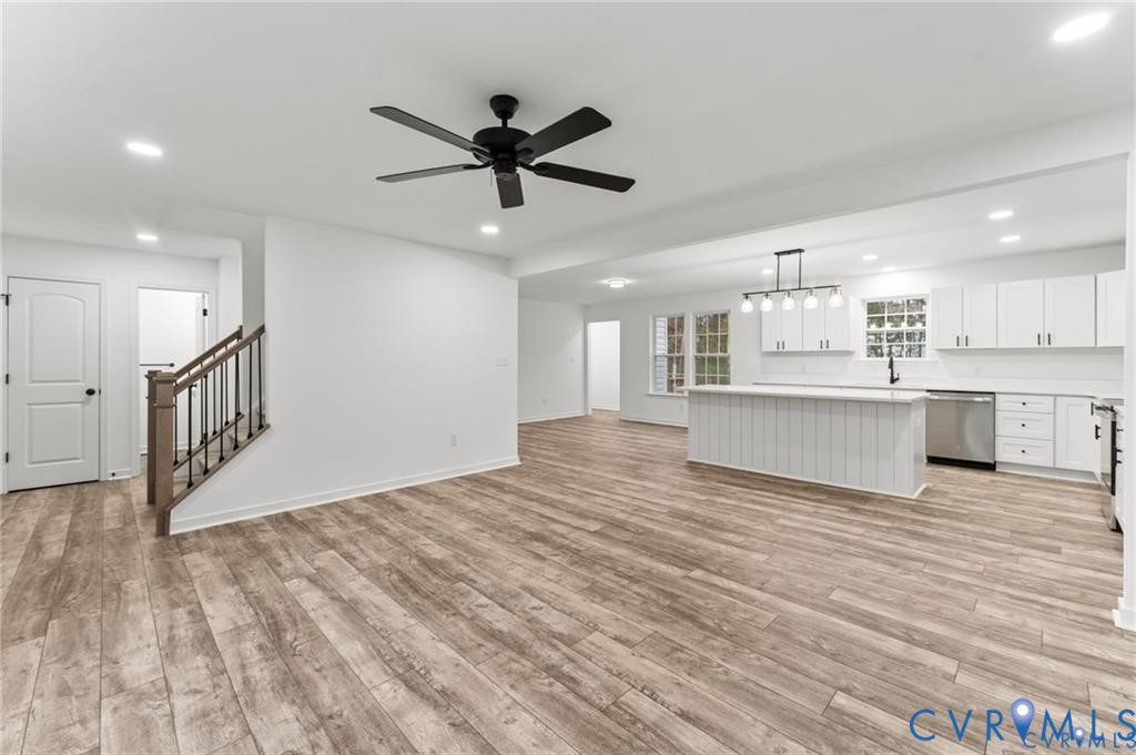 308 Crump Drive Ruther Glen, VA 22546 - Photo 4 of 24 a view of a kitchen with a stove wooden cabinets and wooden floor