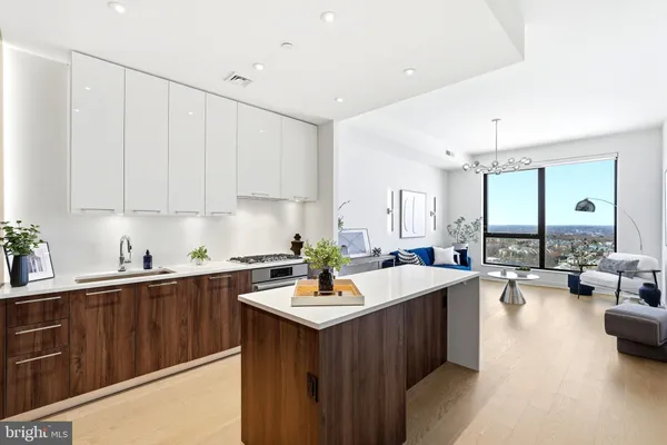 a kitchen with a sink stove and cabinets