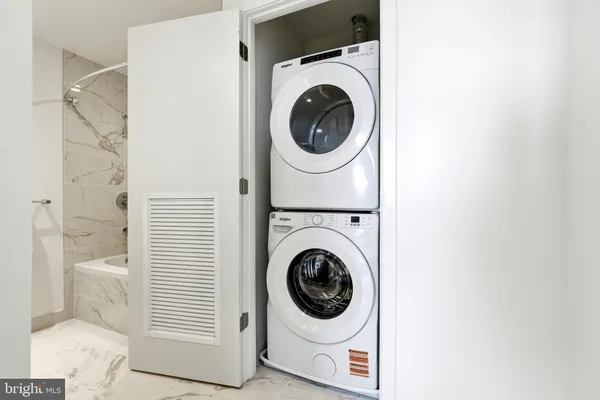 a buildings covered with tall trees