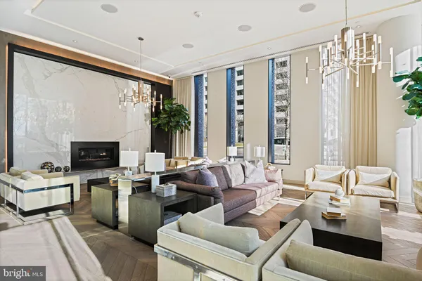 a living room with furniture and flowers