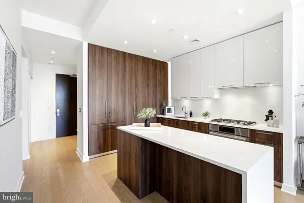 a kitchen with a stove and a refrigerator