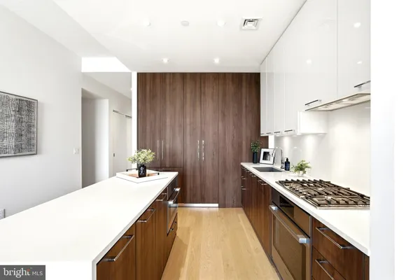 a kitchen with a stove and a sink