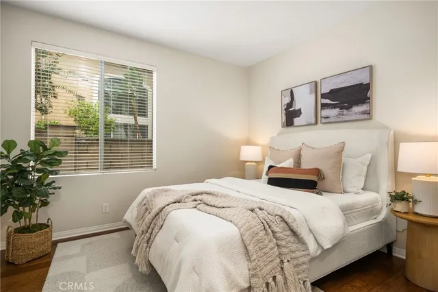 a bathroom with a granite countertop sink toilet a mirror and shower