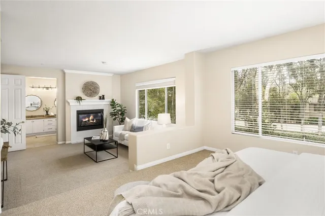 a bathroom with a granite countertop sink mirror toilet and a shower