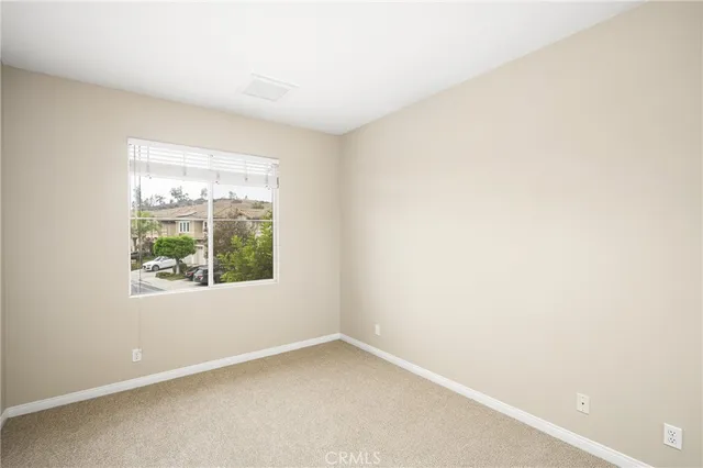 a view of a patio with table and chairs and potted plants
