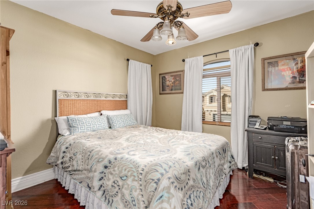 135 Broken Putter Way Las Vegas, NV 89148 - Photo 21 of 40 upstairs Bedroom 2 featuring ceiling fan and dark wood-style floors