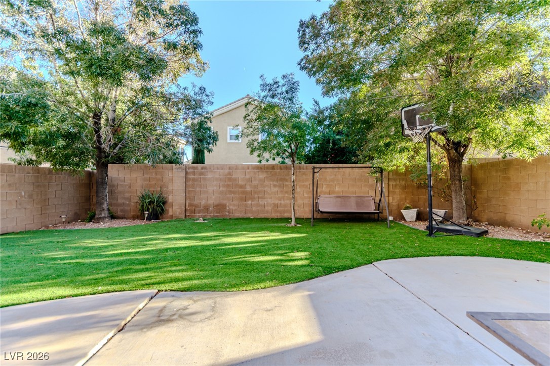 135 Broken Putter Way Las Vegas, NV 89148 - Photo 27 of 40 Fenced backyard featuring a patio