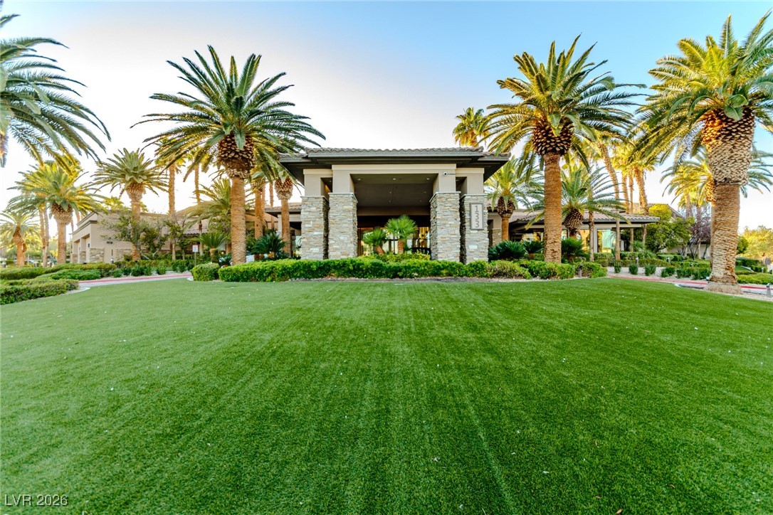 135 Broken Putter Way Las Vegas, NV 89148 - Photo 30 of 40 View of front of house featuring a front lawn, stone siding, and stucco siding