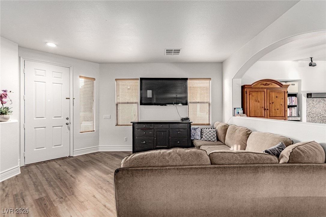 135 Broken Putter Way Las Vegas, NV 89148 - Photo 6 of 40 Living area featuring light wood finished floors and baseboards