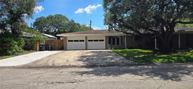 a kitchen with stainless steel appliances granite countertop a refrigerator and a stove
