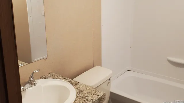 a bathroom with a sink and a toilet