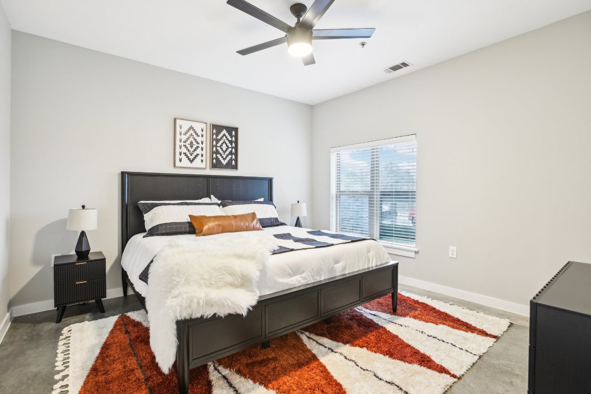 2505 Thornton Road, Unit 1107 Austin, TX 78704 - Photo 10 of 32 a bed sitting in a bedroom next to a window