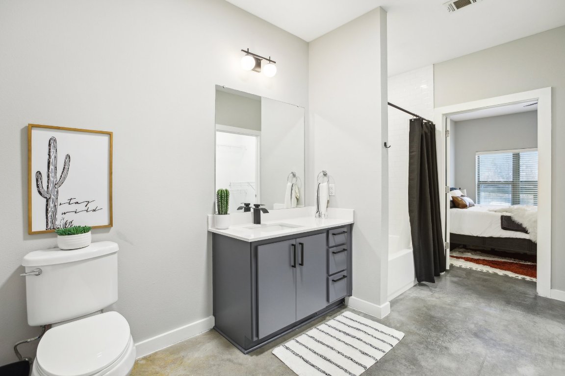 2505 Thornton Road, Unit 1107 Austin, TX 78704 - Photo 17 of 32 a bathroom with a sink a toilet and shower