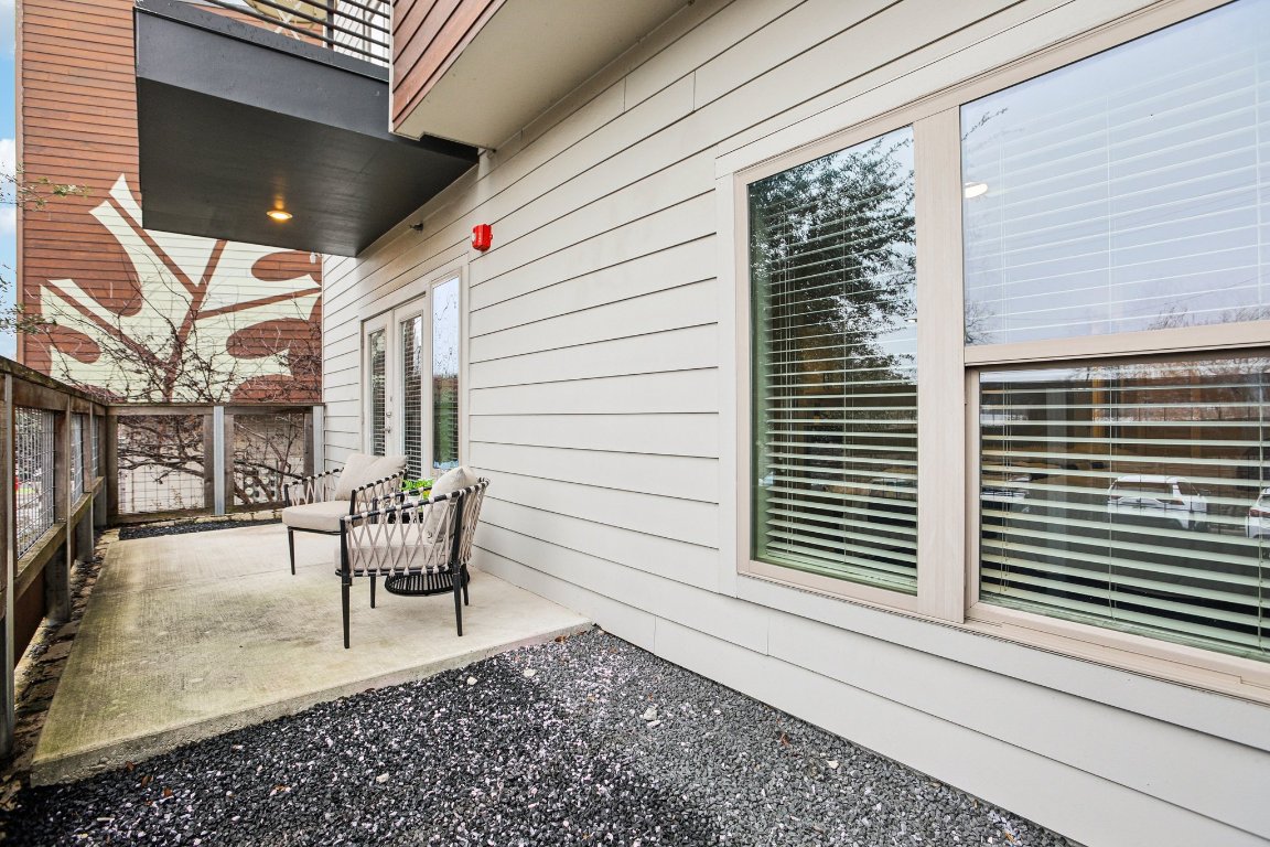 2505 Thornton Road, Unit 1107 Austin, TX 78704 - Photo 29 of 32 a porch with seating space and chairs