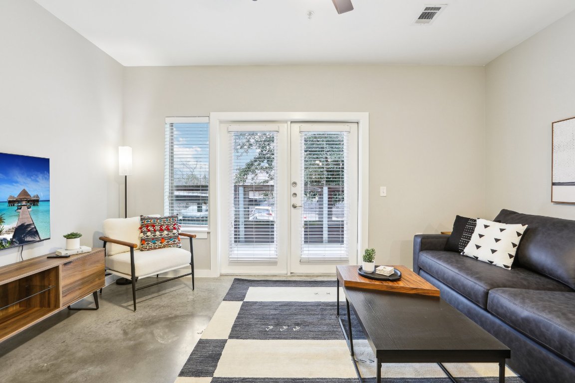 2505 Thornton Road, Unit 1107 Austin, TX 78704 - Photo 6 of 32 a living room with furniture and a rug