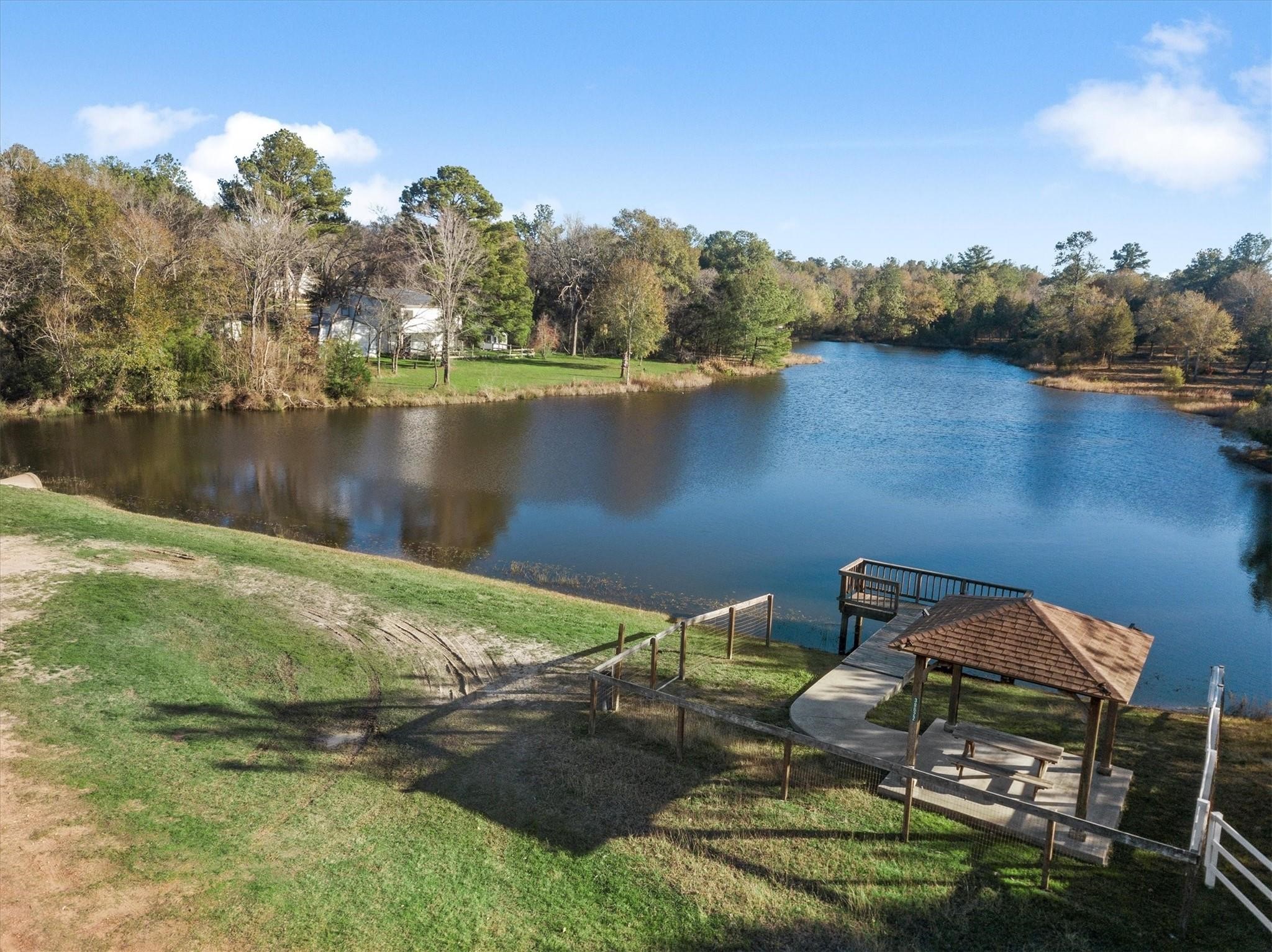 26568 Buck Lane Hempstead, TX 77445 - Photo 4 of 5 a view of a lake in between two chairs