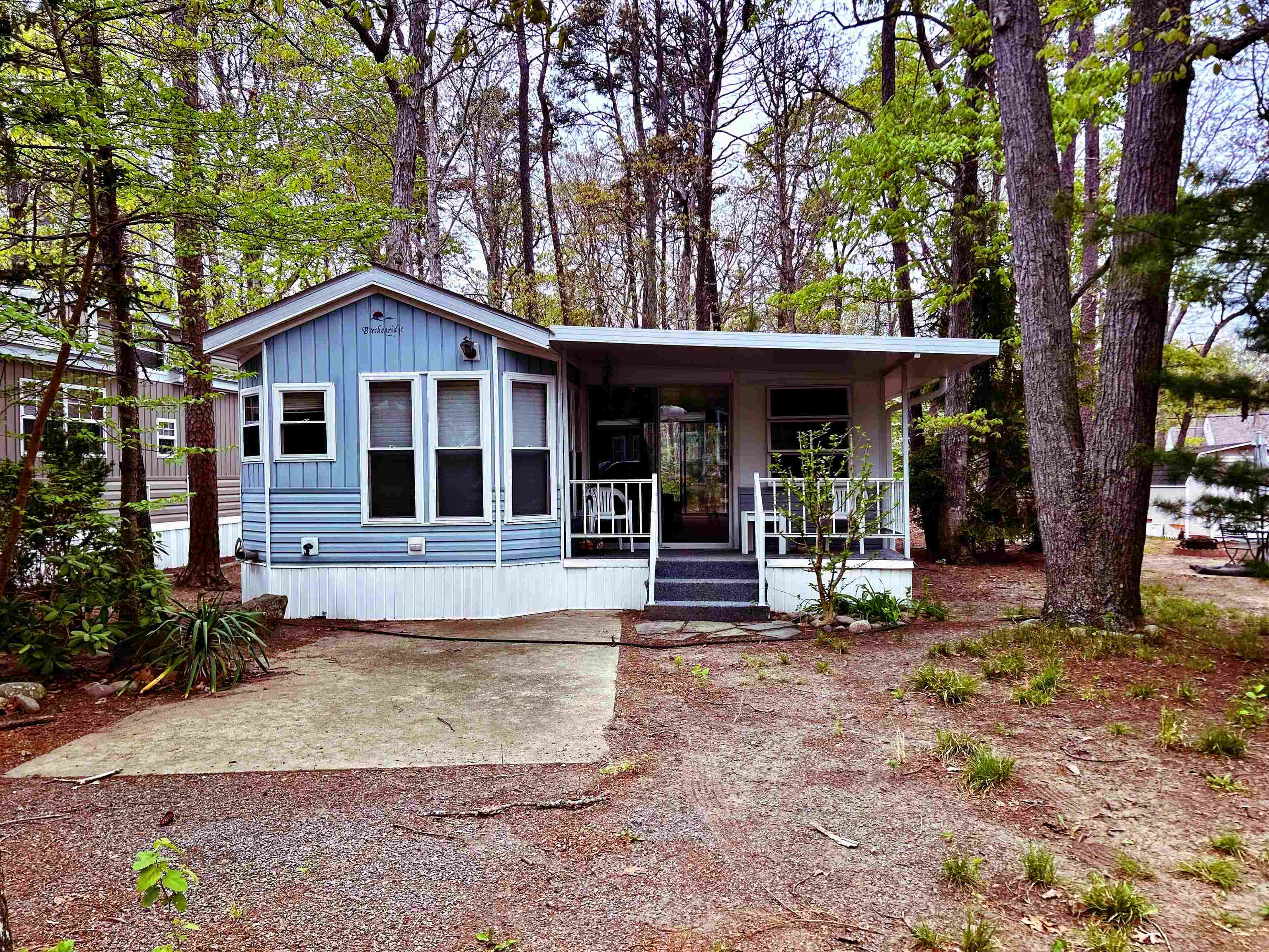 a view of a house with a yard porch and sitting area