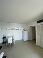 a room with a chair and painted walls