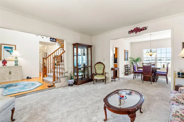 a bedroom with furniture and a chandelier