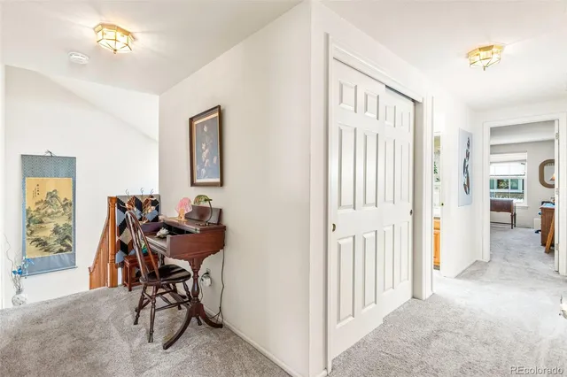 a view of a livingroom with furniture and a window