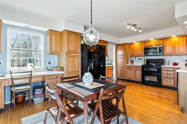 a view of a dining room with furniture window and wooden floor