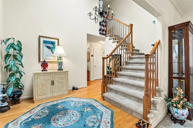 a bedroom with a bed and a potted plant