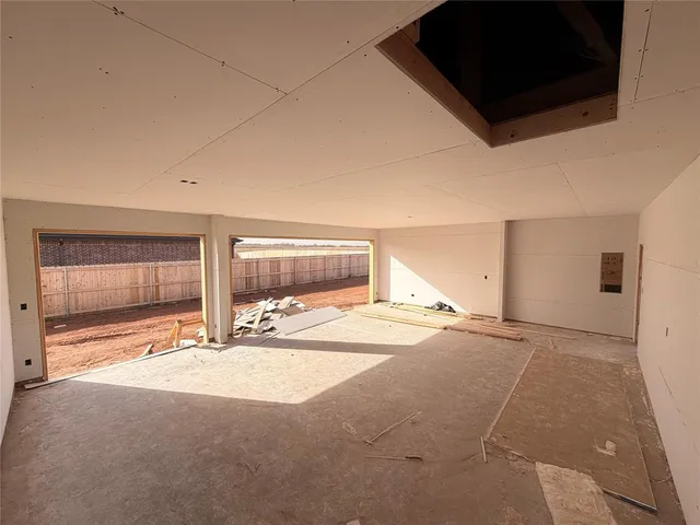 a view of a livingroom with wooden floor and a flat screen tv