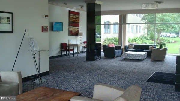 a group of cars parked in a parking lot at street side