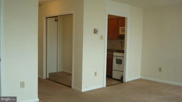 a view of an empty room and fire place