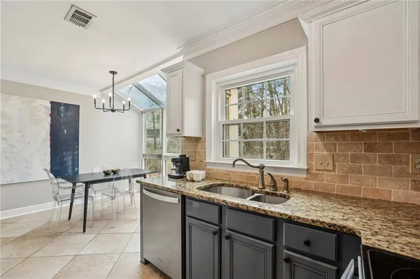 a kitchen with a sink and a window