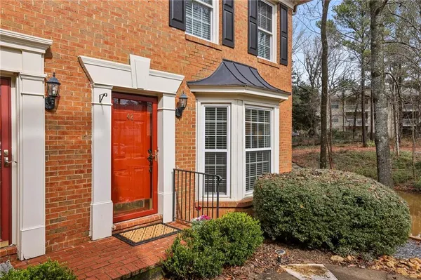 a view of a brick house many windows