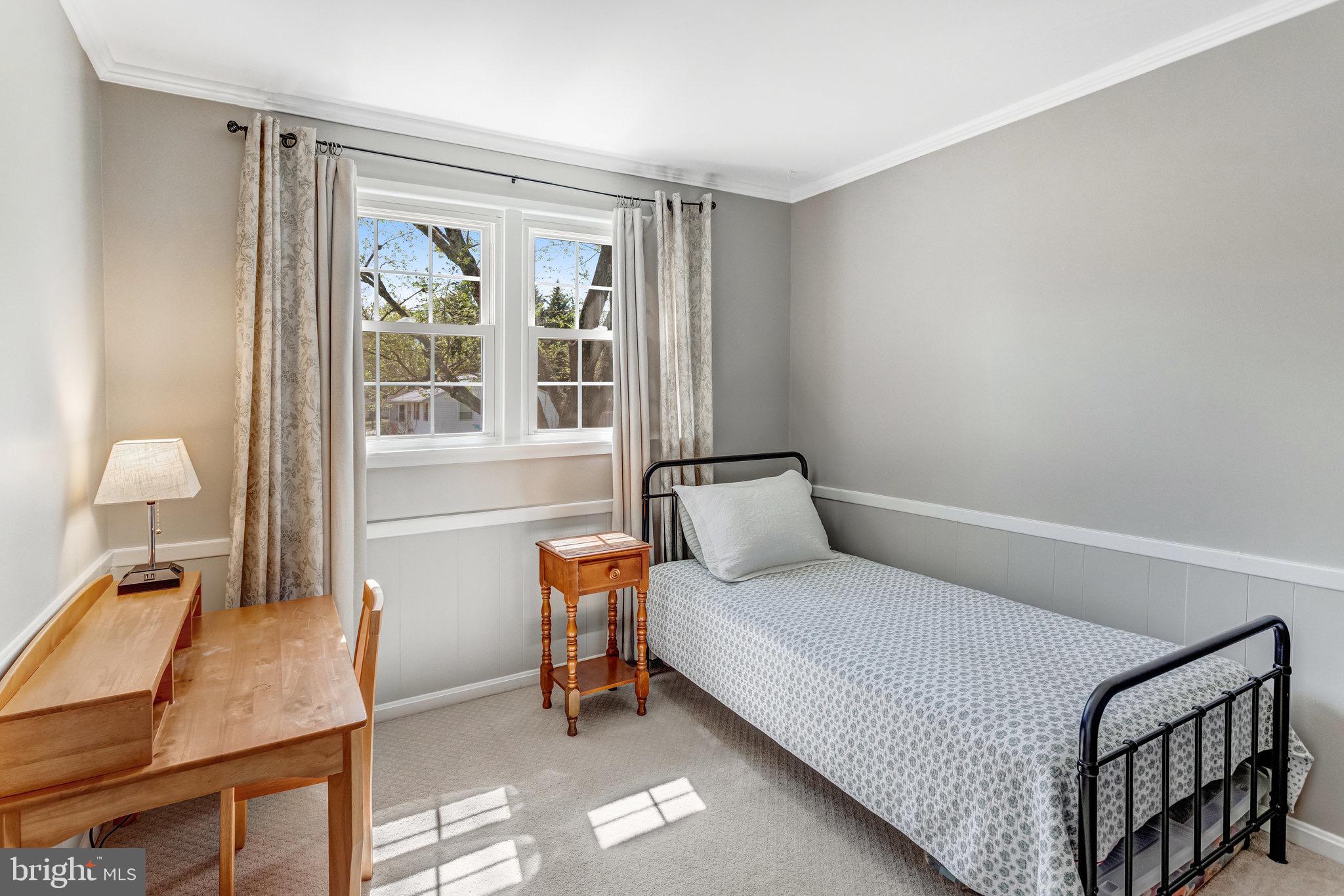 8006 Hatteras Lane Springfield, VA 22151 - Photo 13 of 31 a bedroom with a bed and a table in it