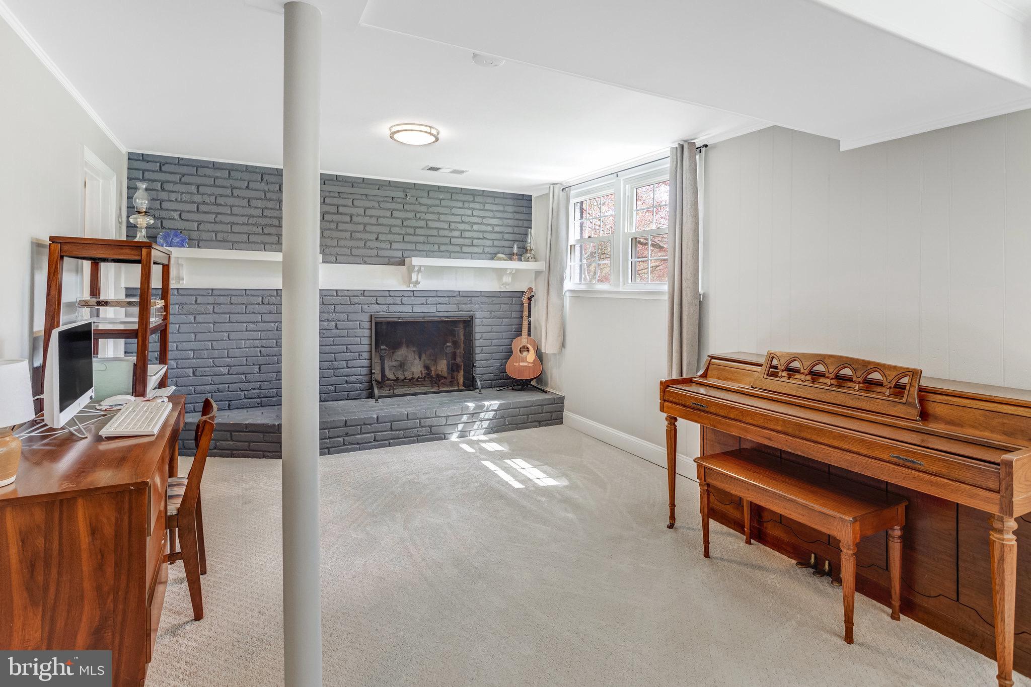 8006 Hatteras Lane Springfield, VA 22151 - Photo 16 of 31 a living room with furniture and a fireplace