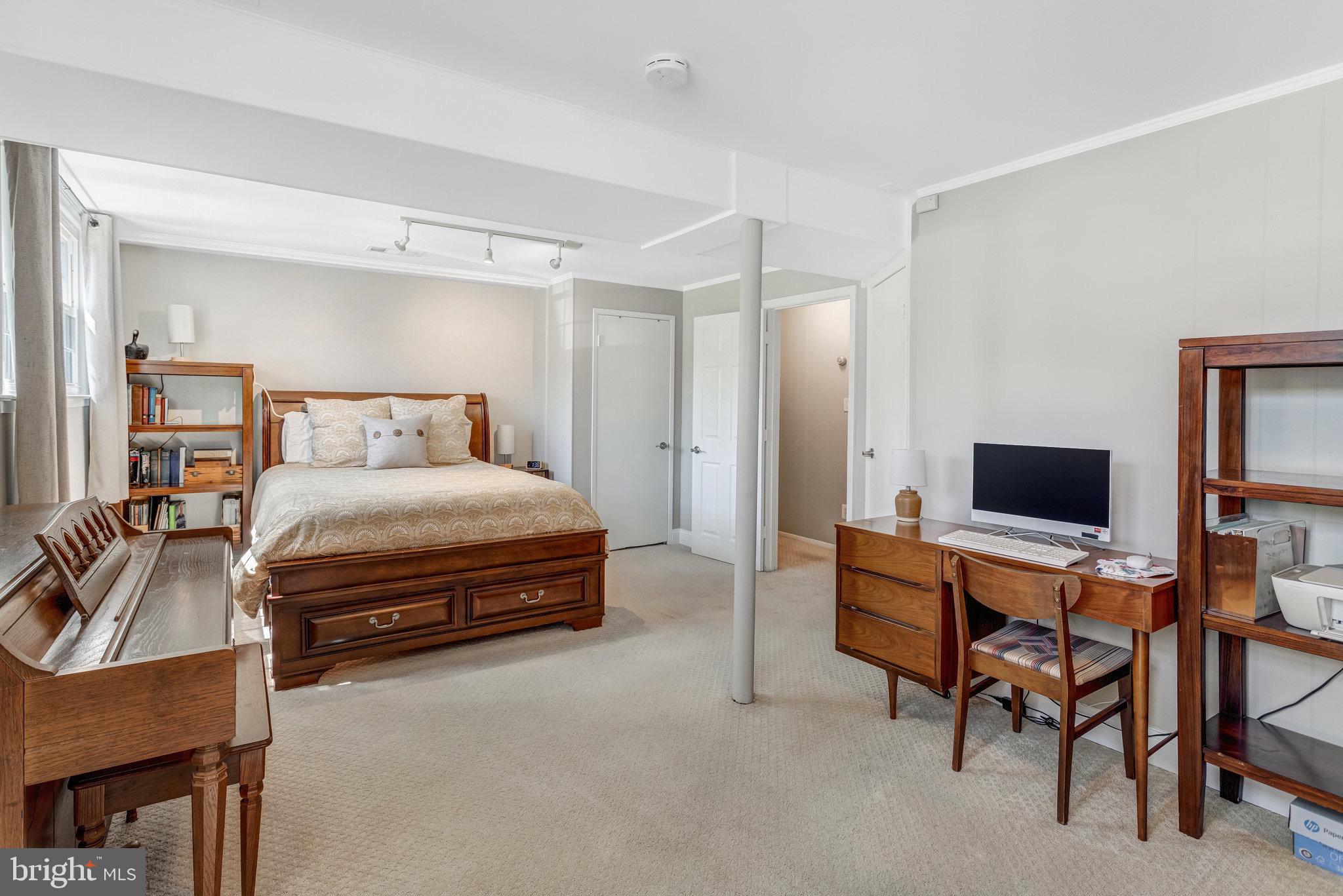 8006 Hatteras Lane Springfield, VA 22151 - Photo 17 of 31 a bedroom with a bed and a flat screen tv