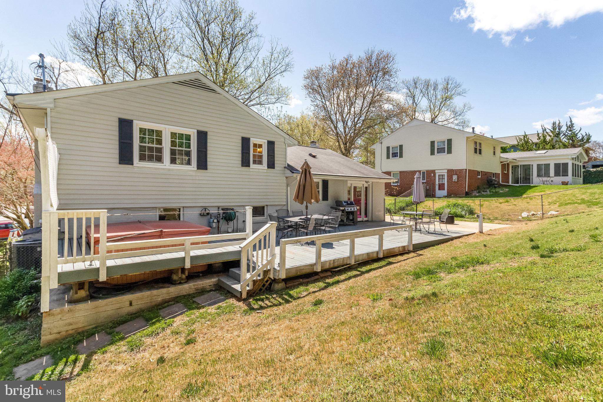 8006 Hatteras Lane Springfield, VA 22151 - Photo 20 of 31 a view of a house with a yard and sitting area