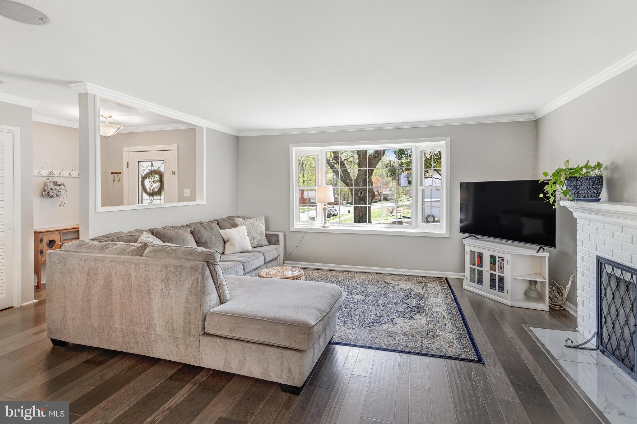 8006 Hatteras Lane Springfield, VA 22151 - Photo 4 of 31 a living room with furniture and a flat screen tv
