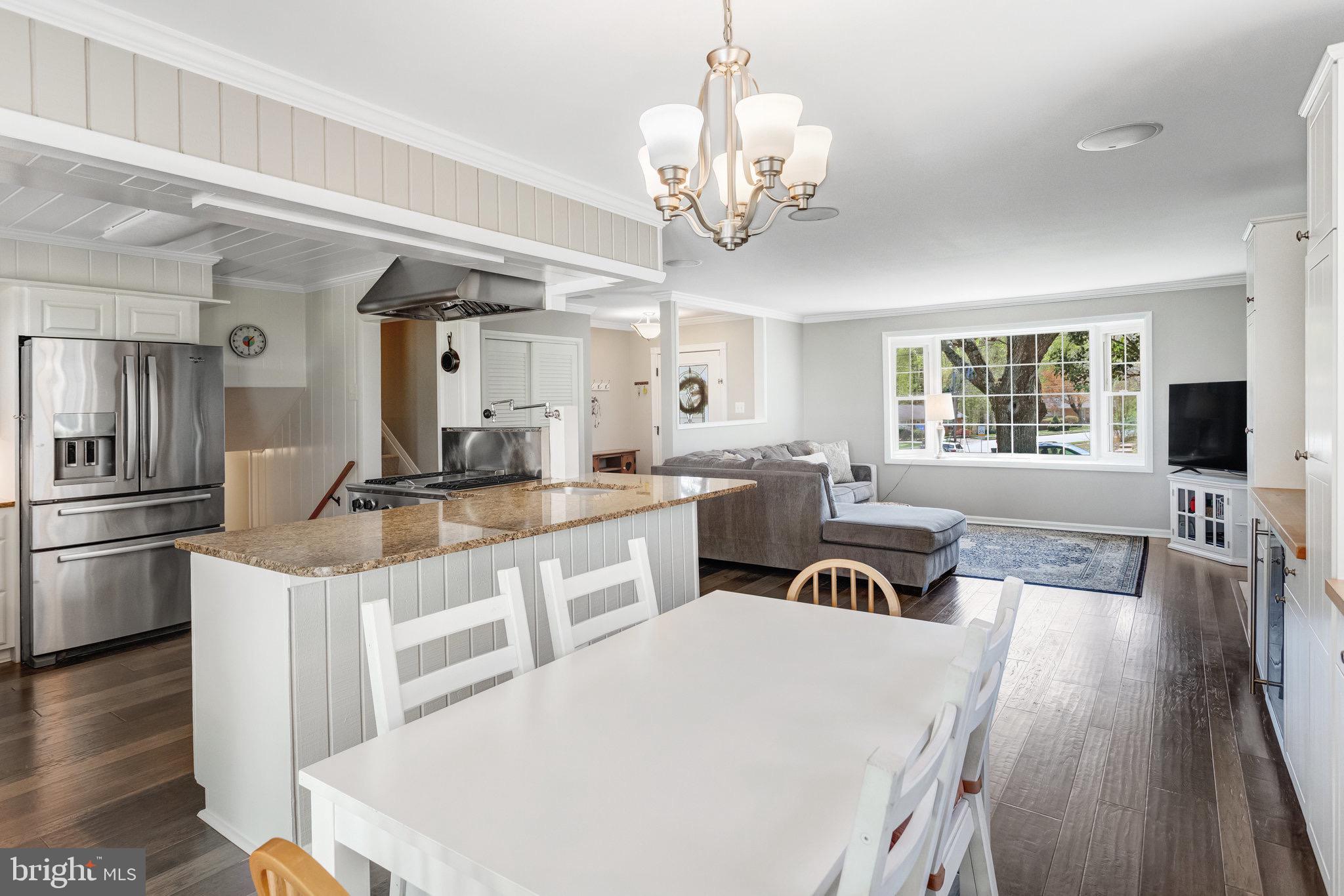 8006 Hatteras Lane Springfield, VA 22151 - Photo 7 of 31 a large white kitchen with stainless steel appliances