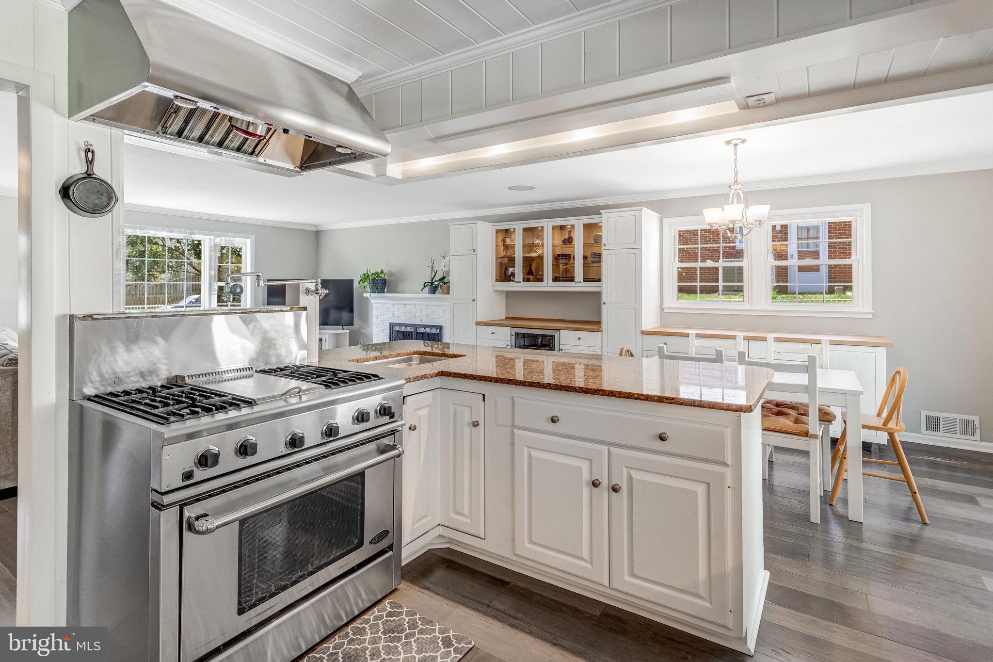 8006 Hatteras Lane Springfield, VA 22151 - Photo 8 of 31 a kitchen with granite countertop a stove and a sink