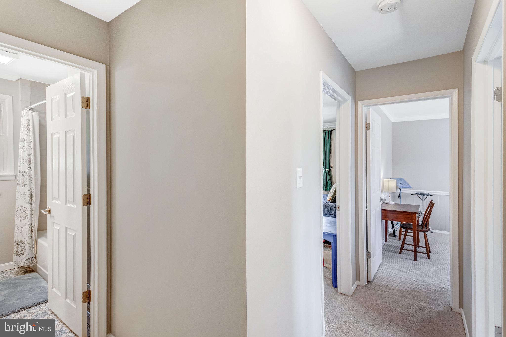 8006 Hatteras Lane Springfield, VA 22151 - Photo 10 of 31 a view of room with wooden floor and a bathroom