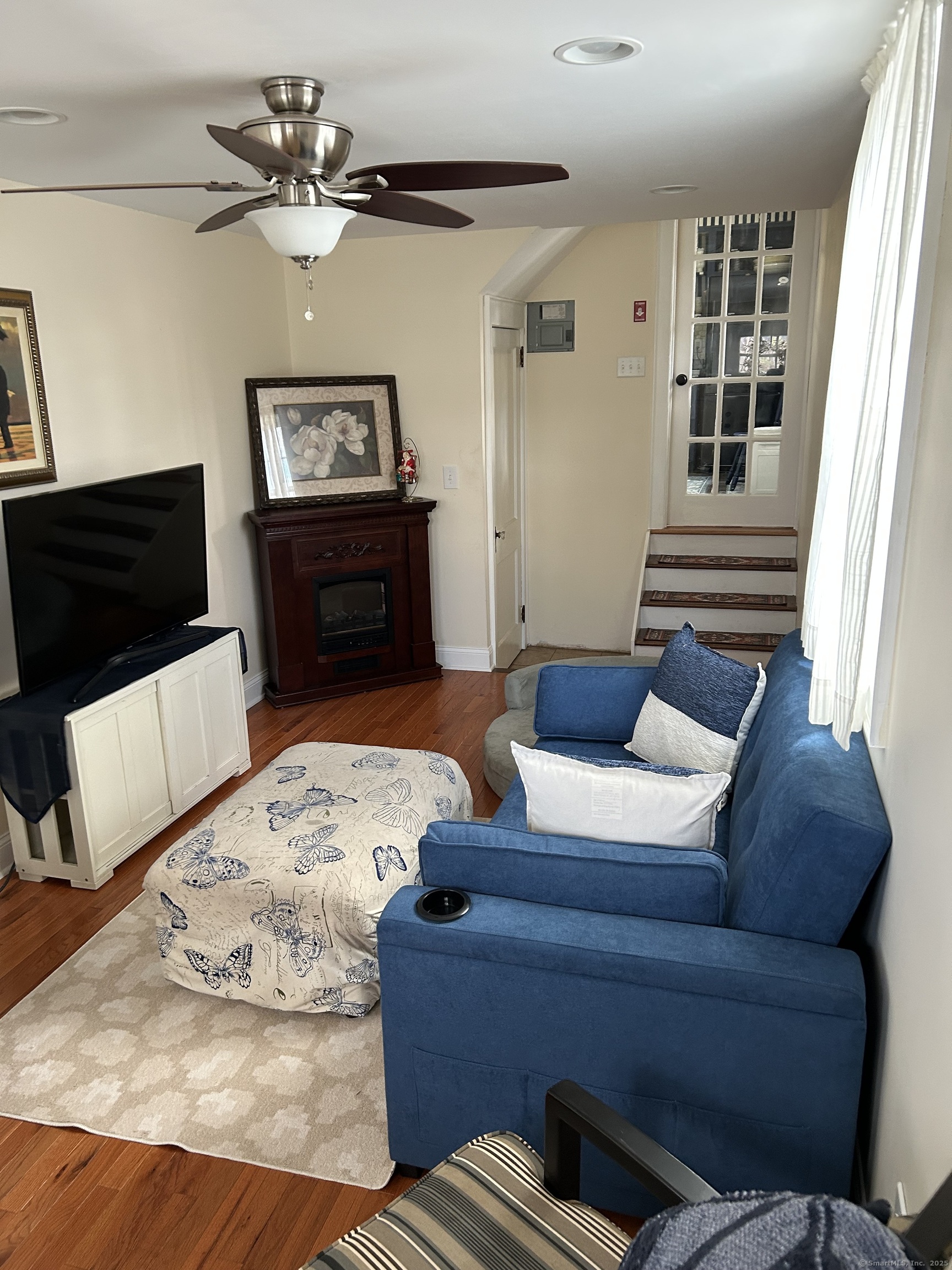 301 Wall Street Meriden, CT 06450 - Photo 11 of 20 a living room with furniture and a flat screen tv
