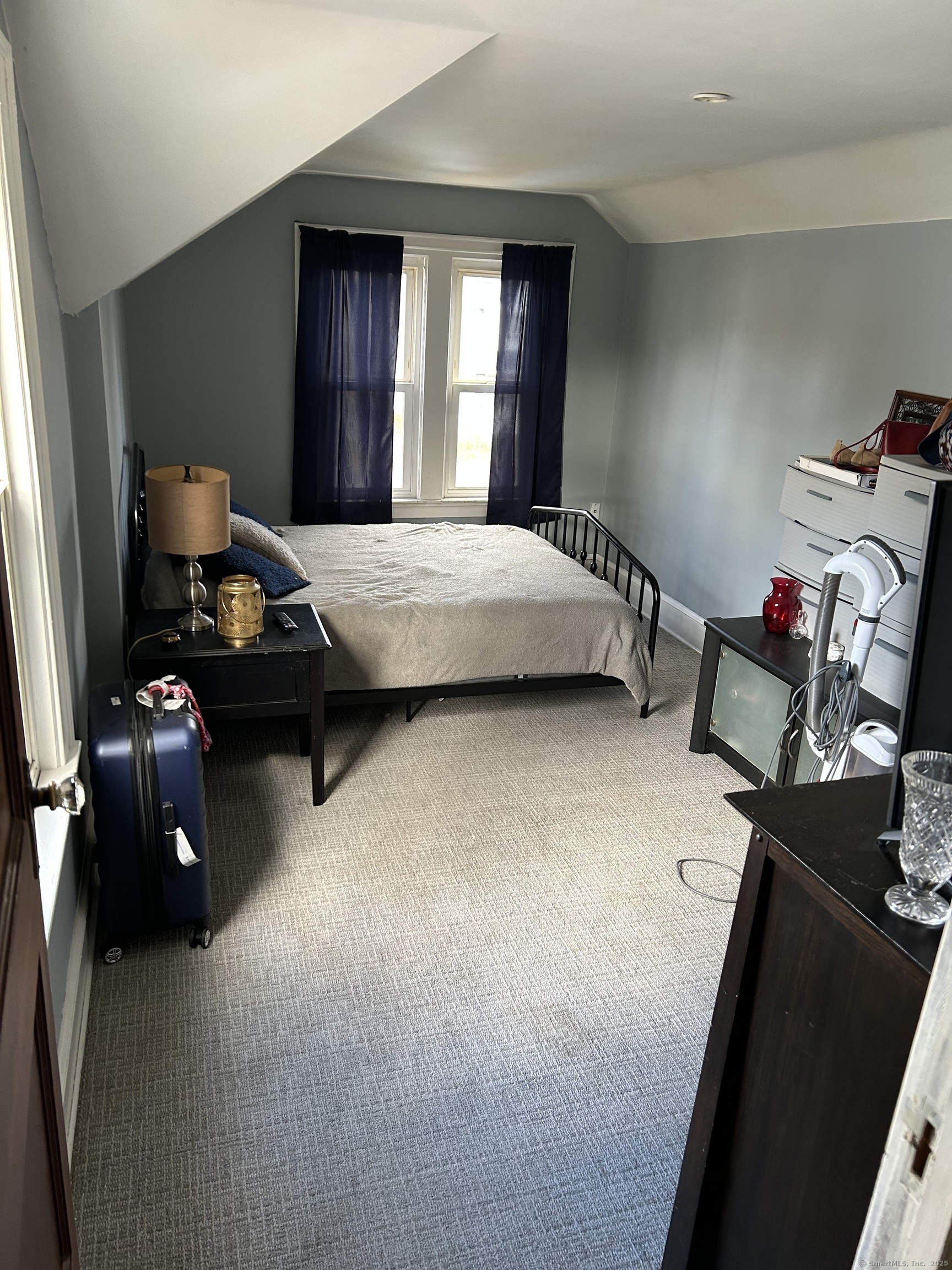 301 Wall Street Meriden, CT 06450 - Photo 17 of 20 a bedroom with a bed and wooden floor