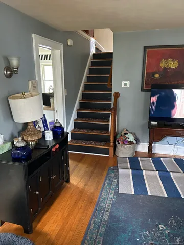 a living room with furniture and a rug