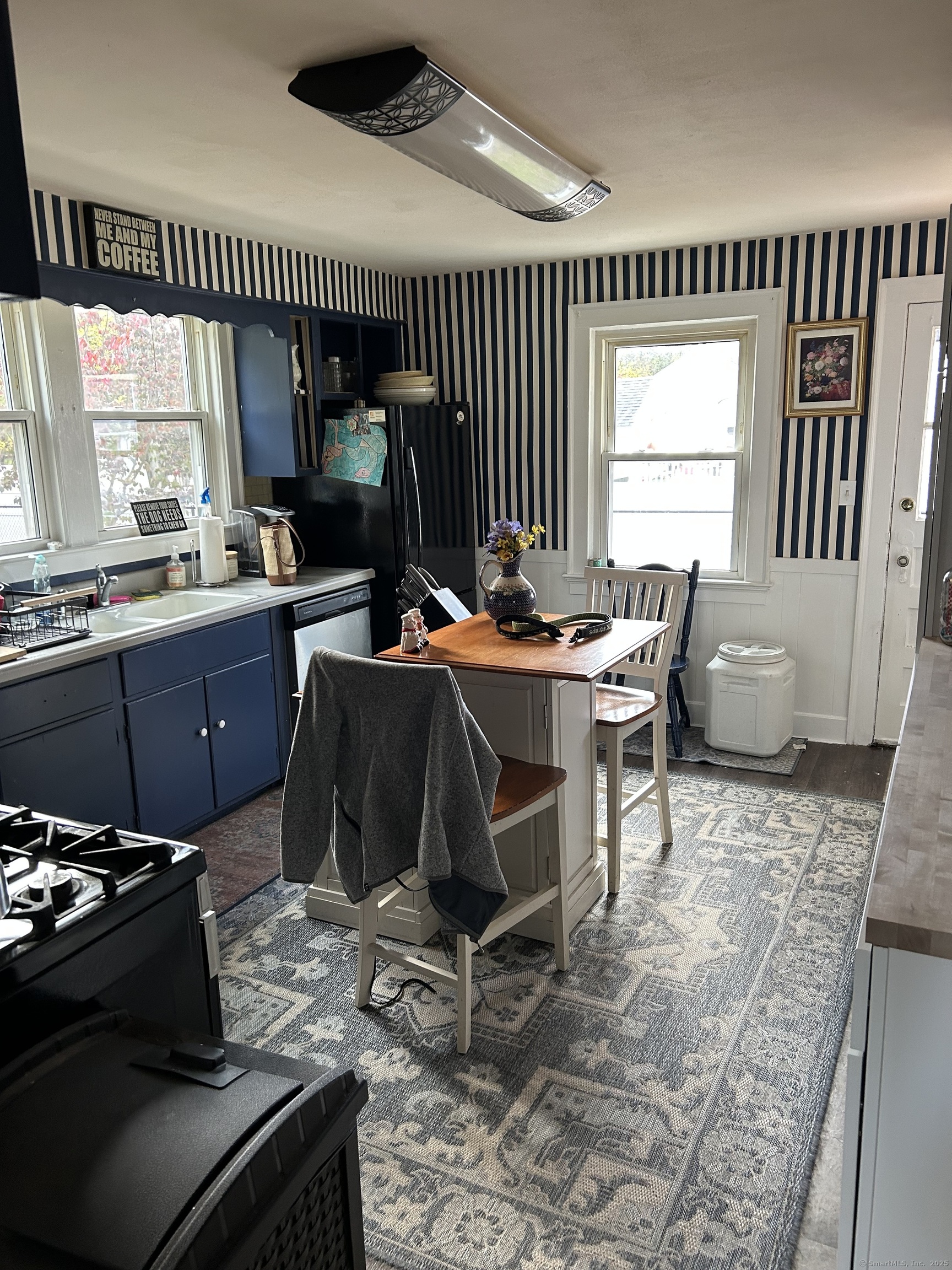 301 Wall Street Meriden, CT 06450 - Photo 8 of 20 a living room with furniture and a large window
