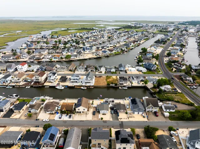 an aerial view of a city with ocean view