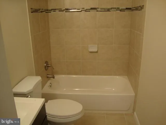 a bathroom with a shower and a toilet