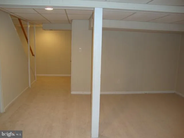 a bathroom with a glass door shower